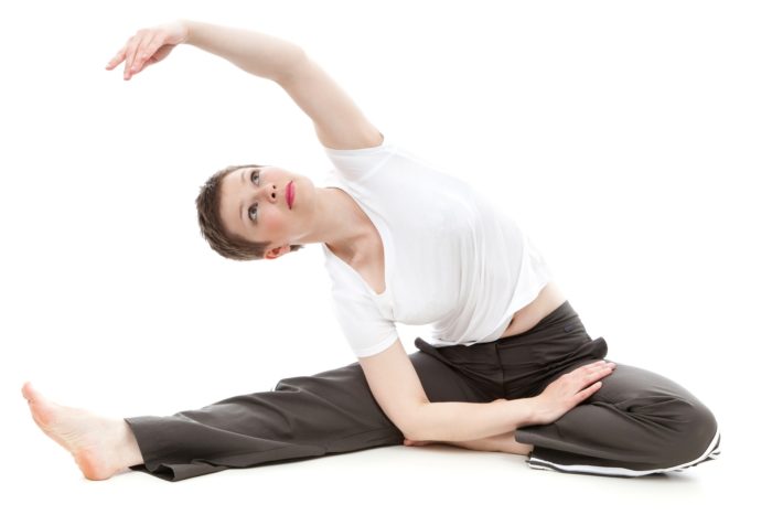 lady stretching for pre-workout